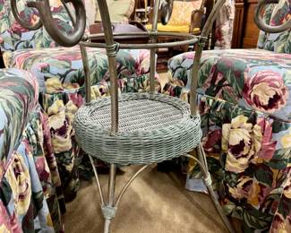Lot #28: Iron and wicker glass topped table with four floral upholstered Parsons chairs on casters