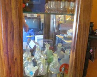 perfume bottles , paperweights, odds and ends