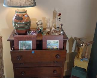 paper weights, marbles, chest of drawers, table lamp