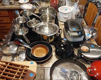 Keurig, Proctor Silex coffee pot, Sunbeam mixer, Magic Bullet, Le Cruset measuring cups and spatulas, Cowboy “cold handle” frying pan