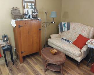 Farmhouse style armoire, oval wicker coffee table, jelly cupboard, high back sofa