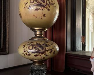 Beautiful converted Gone With the Wind lamp with dragon design and serpent feet dated 1897