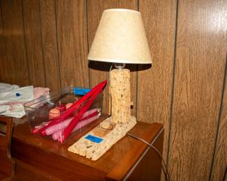 Cactus lamp, candles, linens.