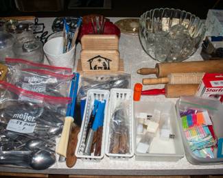 Silverware, knifes, rolling pins, punch bowl with cups.