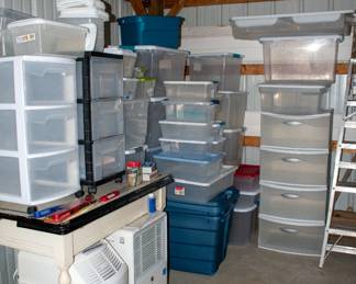 Table, dehumidifier, humidifier, lots of storage totes.