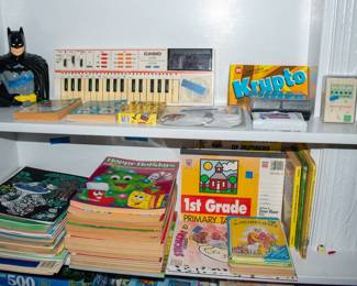 Books, coloring books, casio piano, card games, batman bank.