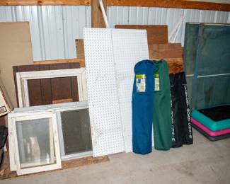 Windows, peg board, various wood, camping chairs.
