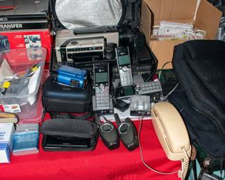 Video cameras, home phones, walkie talkies, extension cords, Garmin gps, battery charger.