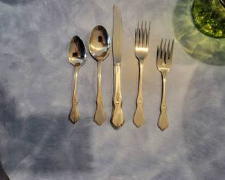 Oneida (Morning Blossom) stainless flatware. 12 place settings and 1 serving spoon. 61 pieces.  