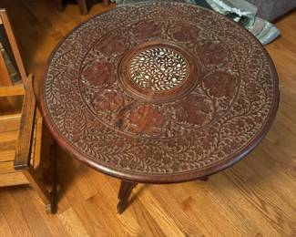 Vintage hand-carved wooden side table with beautiful, intricate inlay. Made in India.