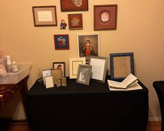 Fames and framed artwork.