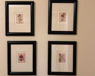 Set of four framed floral water color artwork.
