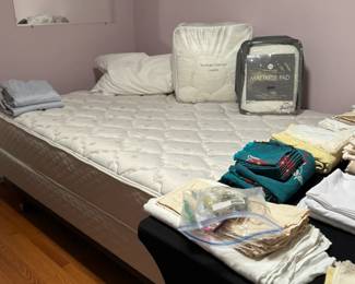 Queen size bed and linens.