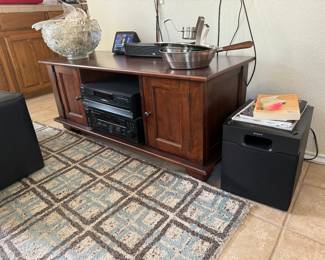 Entertainment cabinet from Pottery Barn and fantastic teal and brown area rug (5 x 8)