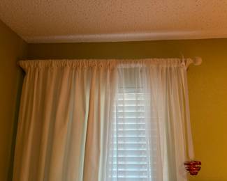 Cream sheers/ drapes.