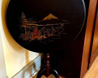 Small table that tilts into position