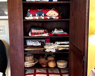 Gorgeous large cabinet filled with quilts and treasures.