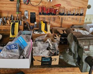 Items shown on one of the workbenches, including the vice