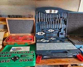 Additional tap and dice sets on wooden workbench With drawers