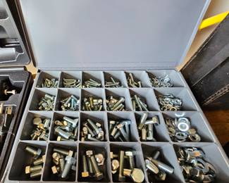 Metal box filled with nuts and bolts