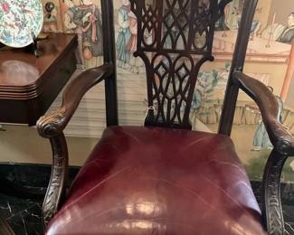 Leather seat arm chair with beautifully carved back
