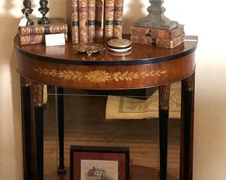 Demi-lune 2-tier table; antique books; cross 