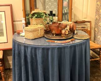 Round table beneath the custom table cloth