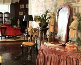 Skirted entry table; mirror; Asian statues