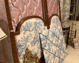 Upholstered twin beds and coordinating bulletin board