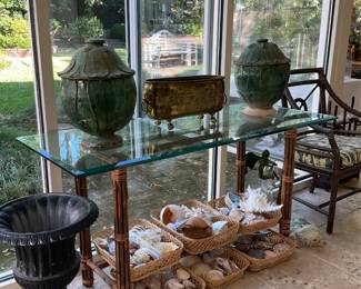 Glass top table; rare Chinese urns; baskets of shells