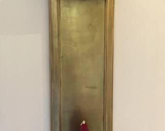 One of two brass wall candle holders