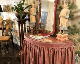 Skirted entry table; mirror; Asian statues