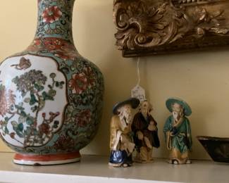 One of two matching vases; mudmen