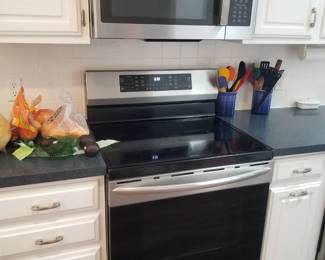 Frigidaire Gallery electric induction range; GE microwave oven
