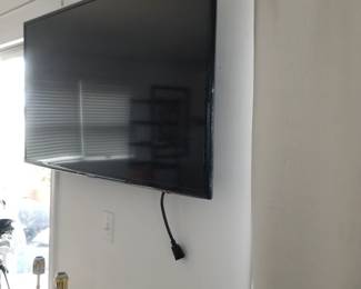 Flat screen TV with wall mount