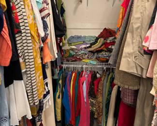 So many woman’s clothes - multiple closets packed full 