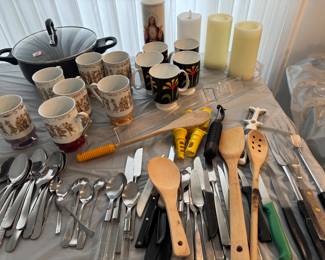 Utensils, coffee cups and candles 