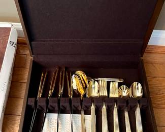 Gold tone Faberware flatware set with box