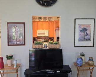 oversized wall clock , TV stand and electronics