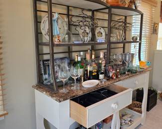 This breakfront or breakfast bar could serve as a bar or robust coffee station