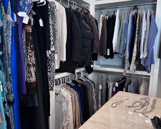Closet full of designer clothing