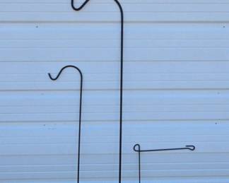 Two Black Metal Yard Hooks And A Black Metal Flag Holder