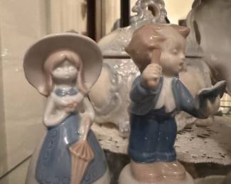 Porcelain Blue, White and Pink Girl with Umbrella Figurine, Porcelain Blue/White Boy Conducting Music Figurine