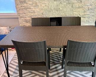 outdoor woven material dining table & 4 chairs (the TV in this photo is not for sale)