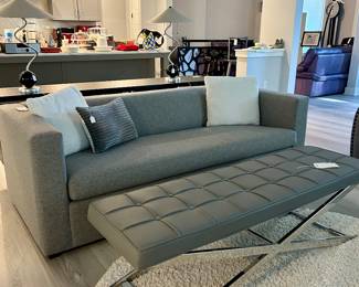 Gray upholstered sleep sofa & tufted bench
