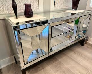 Mirrored credenza, 65” long, 35” tall, 18.5” deep