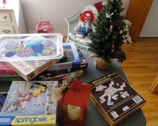 Puzzles and games too, just look at Chuck back there all happy.  You just know that he walks around the house in the middle of the night