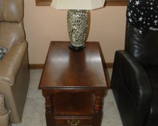 Solid wood table with small drawer with a lamp on top