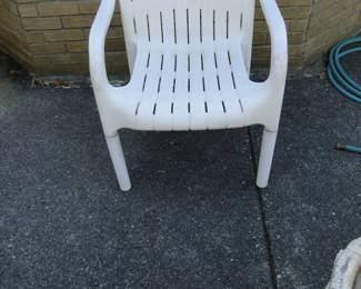 2 of 4 plastic chairs, this one at the time is around the corner from the other one, but we might be able to pull them in all together to go with the table that is in the basement