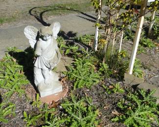 Outdoor cement statue of Guardian Angel